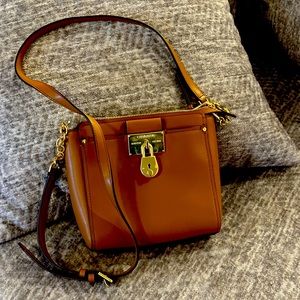 Gently used Calvin Klein cross body bag with several pockets.